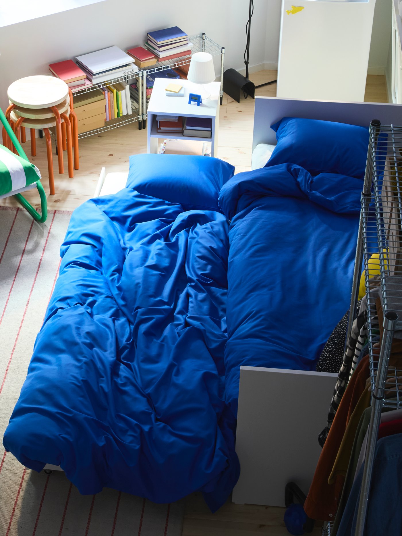 The trundle bed under VIHALS day-bed pulled out, extra duvet and pillow pulled out of DIMPA storage bag.