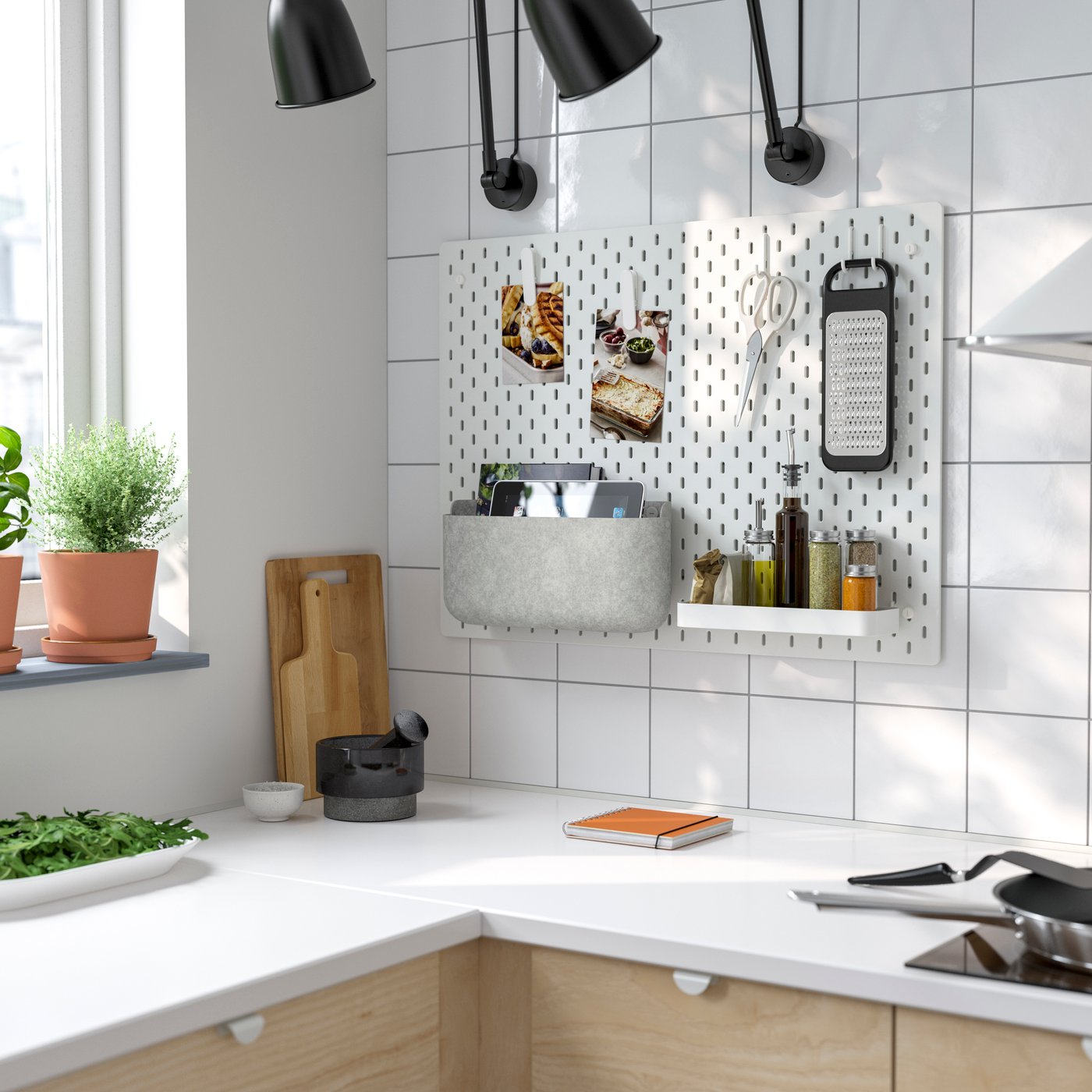 A grey SKÅDIS storage basket