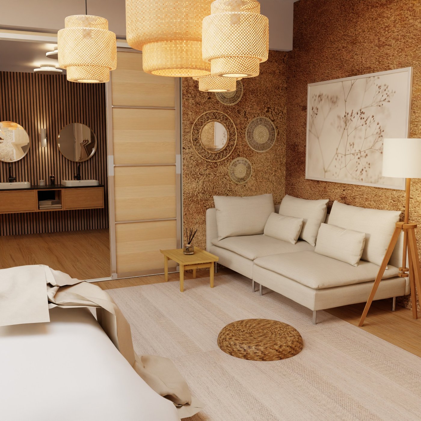 Teil eines Hotelzimmers. Blick auf ein Sofa mit Beistelltisch und Standleuchte. An der Wand darüber dekorative Elemente. Im Hintergrund der Durchgang zum Bad und ein Doppelwaschtisch mit zwei runden Spiegeln darüber.