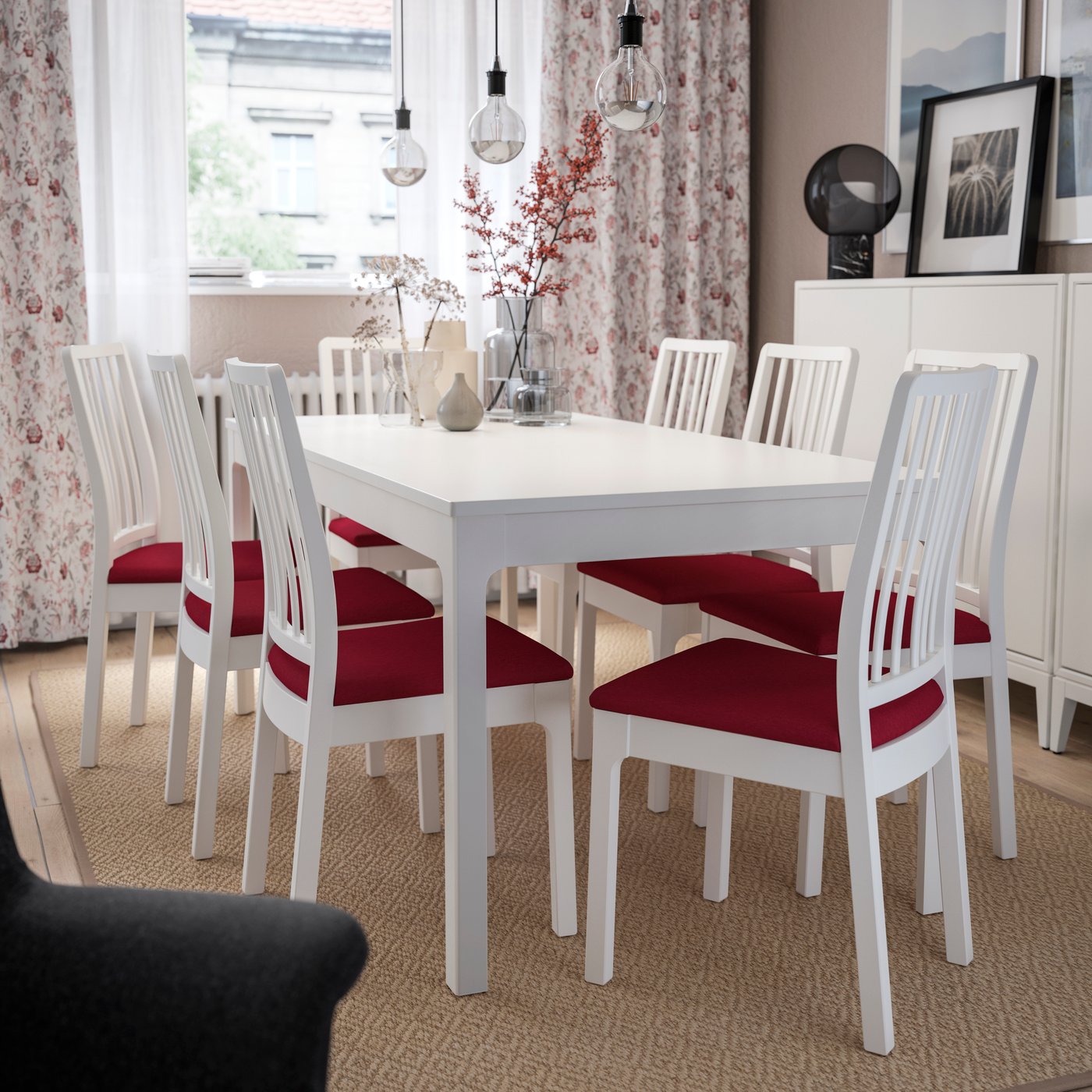 An EKEDALEN chr white/Orrsta red  in the dining room