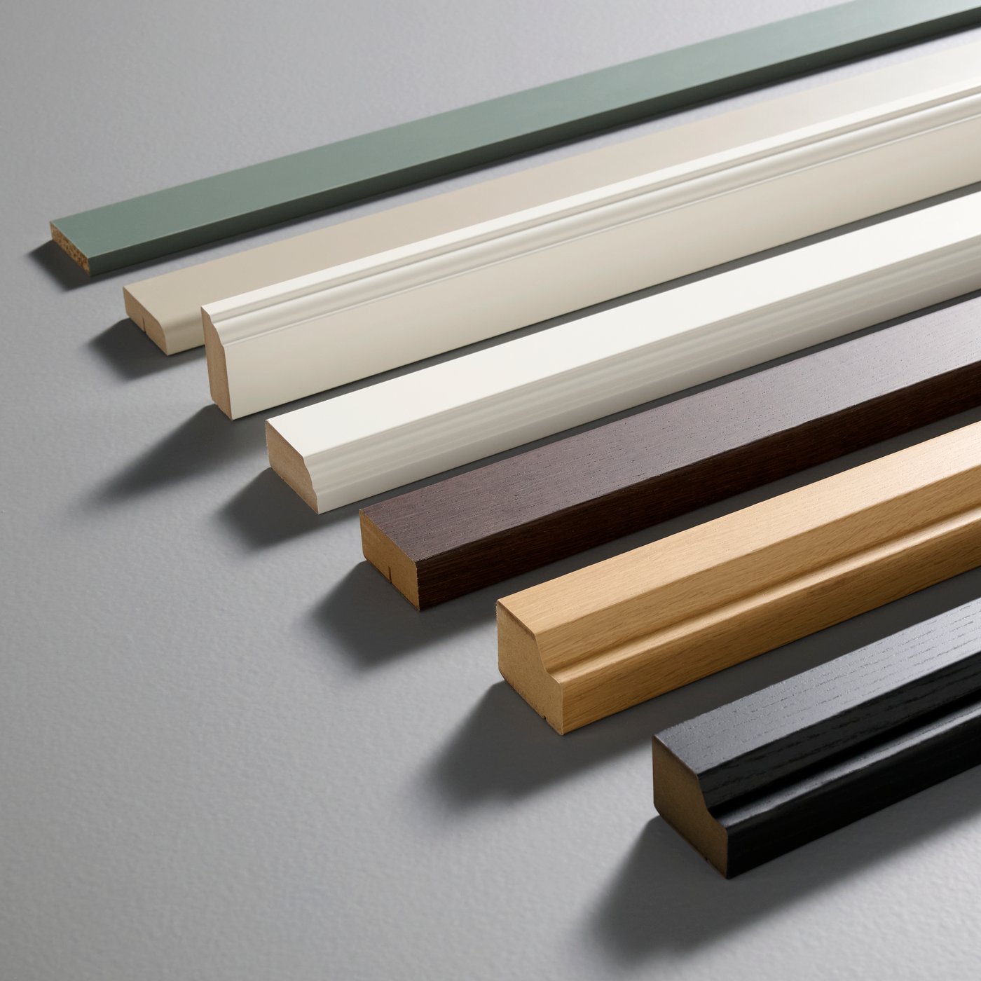 BODBYN deco strip in off-white placed with other kitchen deco strips in green, brown, oak effect, and black finishes.