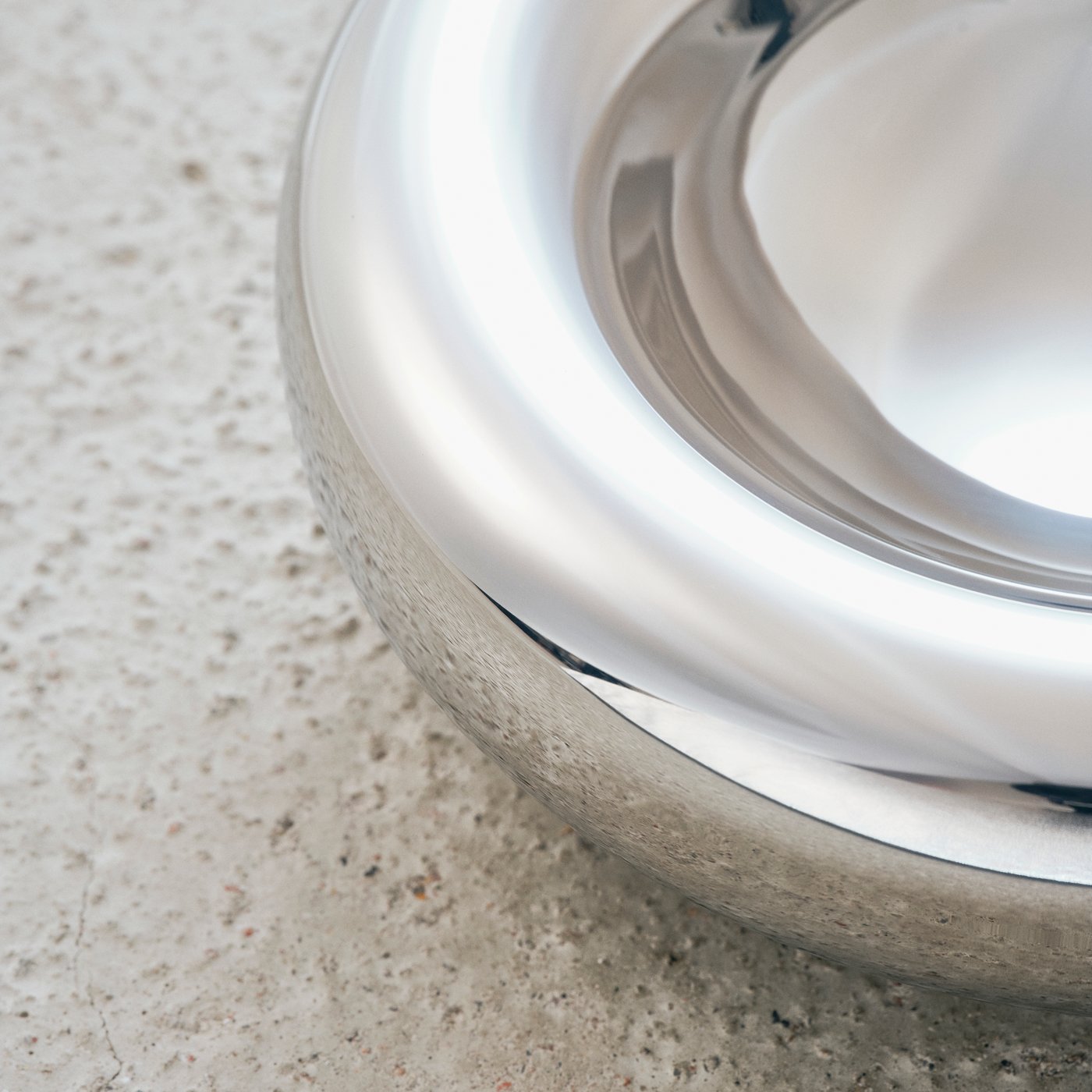 Close up of a shiny metallic bowl made by Andu Masebo as a part of IKEA KONSTRUNDA art collection.