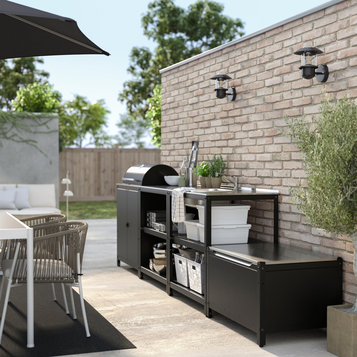 A stainless steel GRILLSKÄR outdoor kitchen w charcoal barbecue