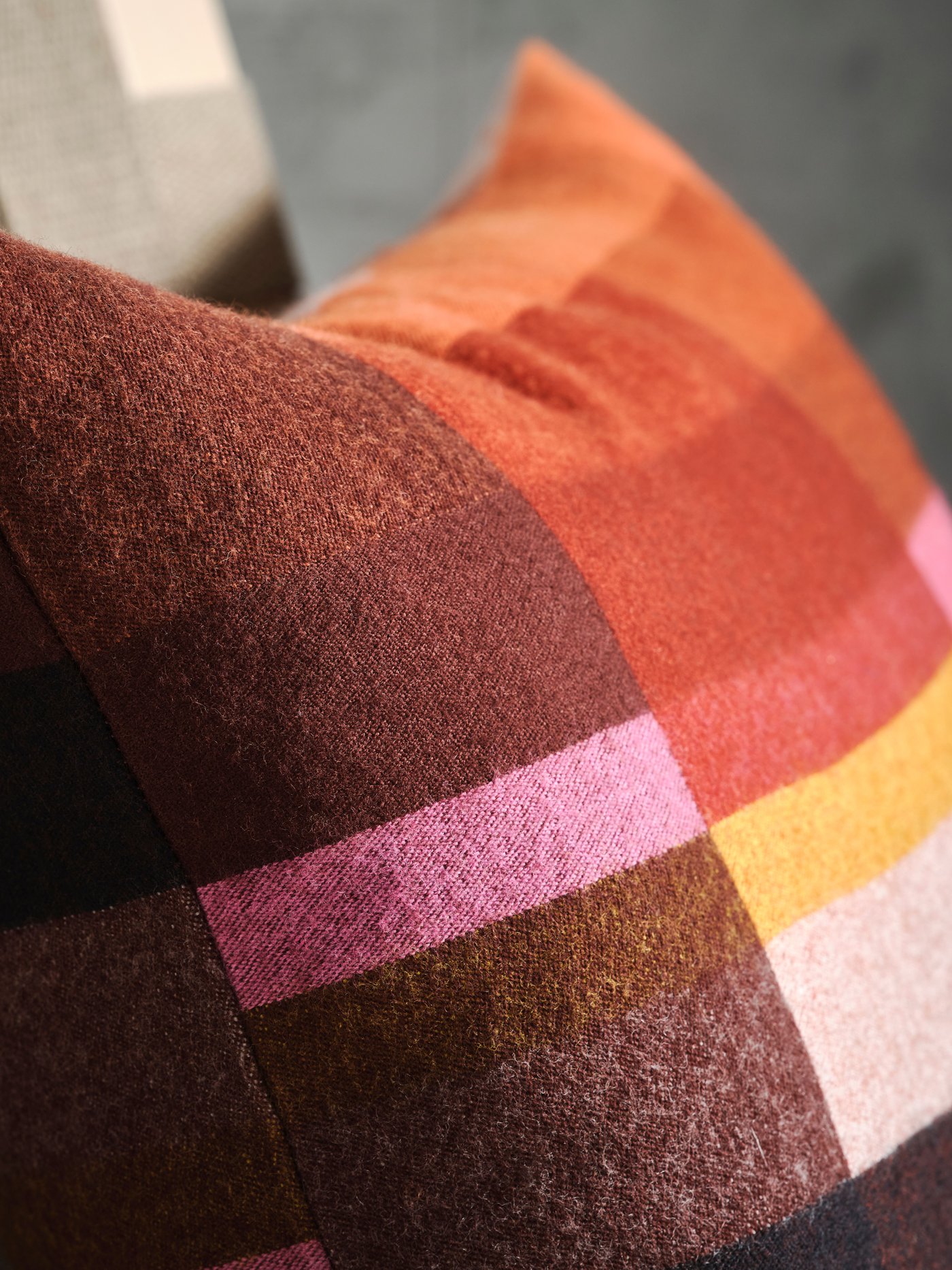 A brown-red/bright pink STOCKHOLM 2025 cushion cover