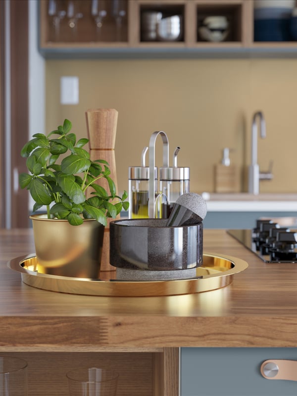 A glass/stainless steel ÖRTFYLLD 3-piece oil/vinegar set in the kitchen