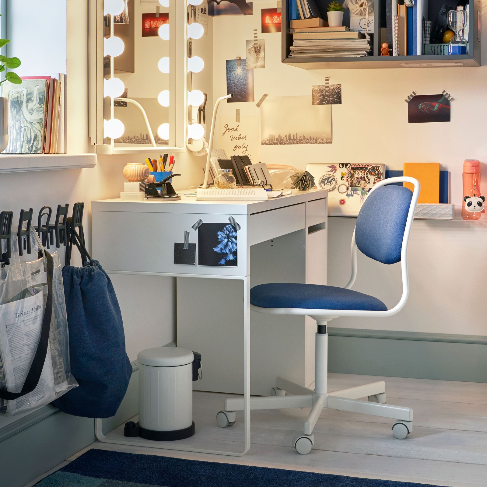 A dark grey EKET cabinet with 4 compartments in the home office