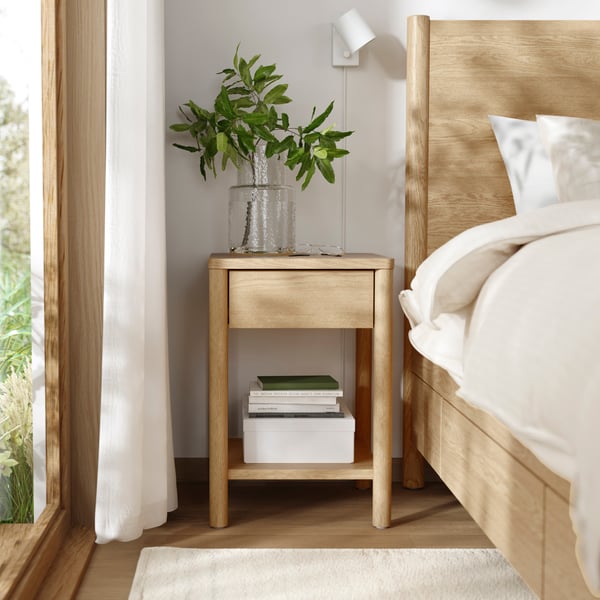 An oak veneer TONSTAD bedside table