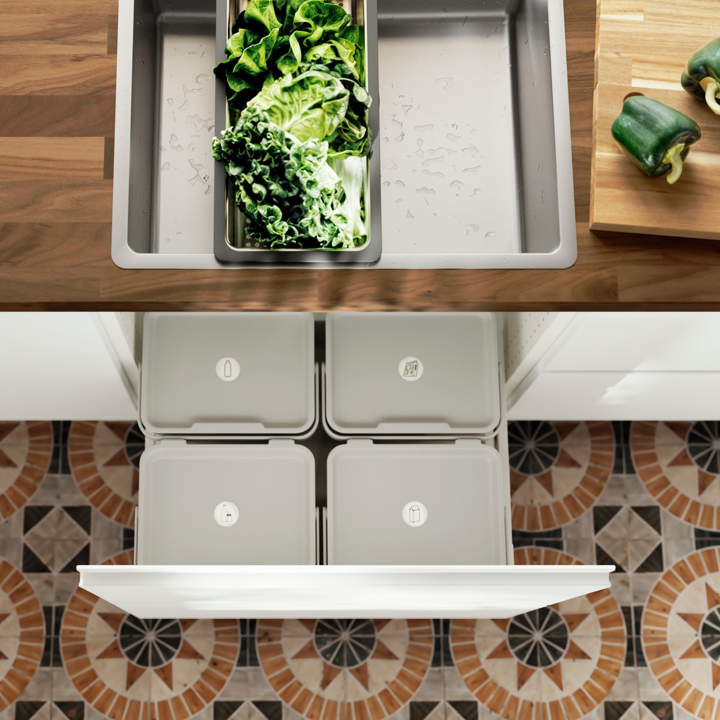 Two kitchen drawers under a sink have been pulled out, and there are HÅLLBAR bins with lids and cleaning products inside them.