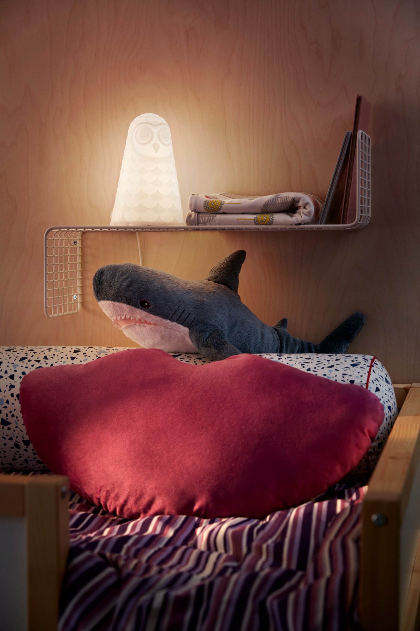 A shark BLÅHAJ soft toy in the bedroom