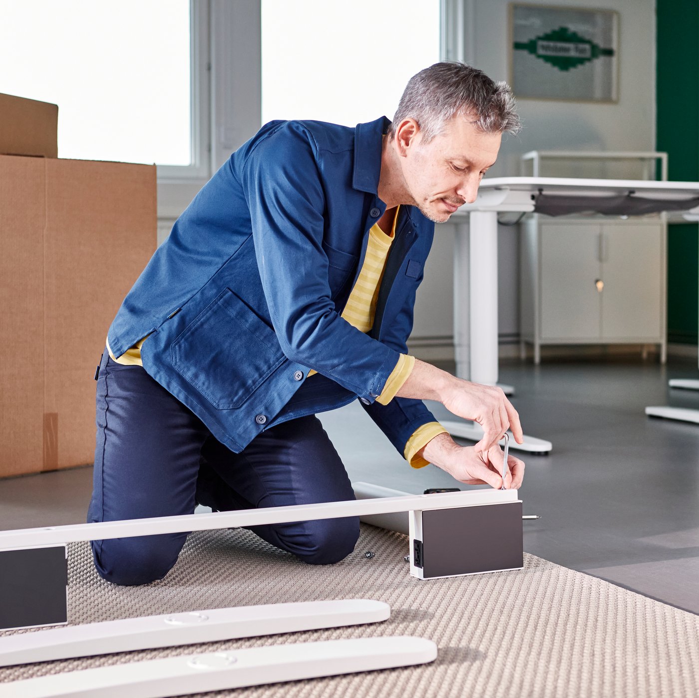 A person assembling an IKEA product