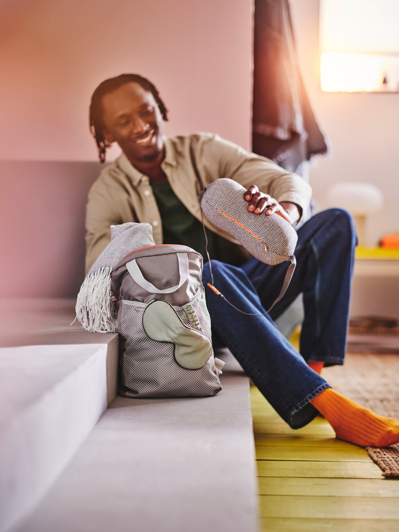 A RAGGARV neck/lumbar pillow in the hallway