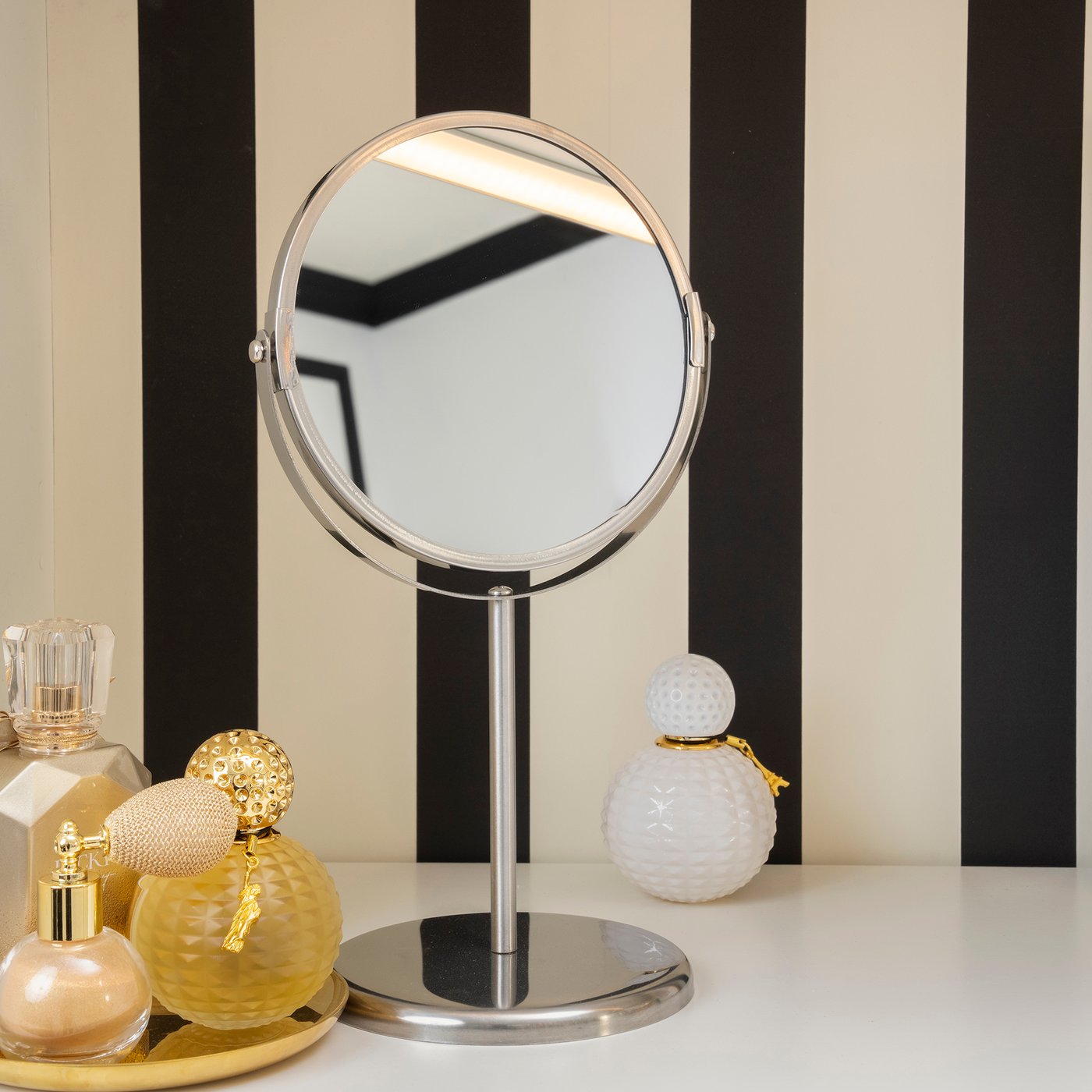 A stainless steel TRENSUM mirror