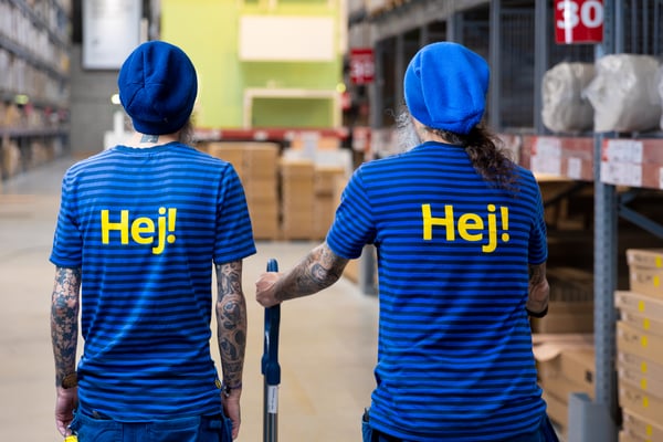 Two IKEA co-workers in an IKEA warehouse
