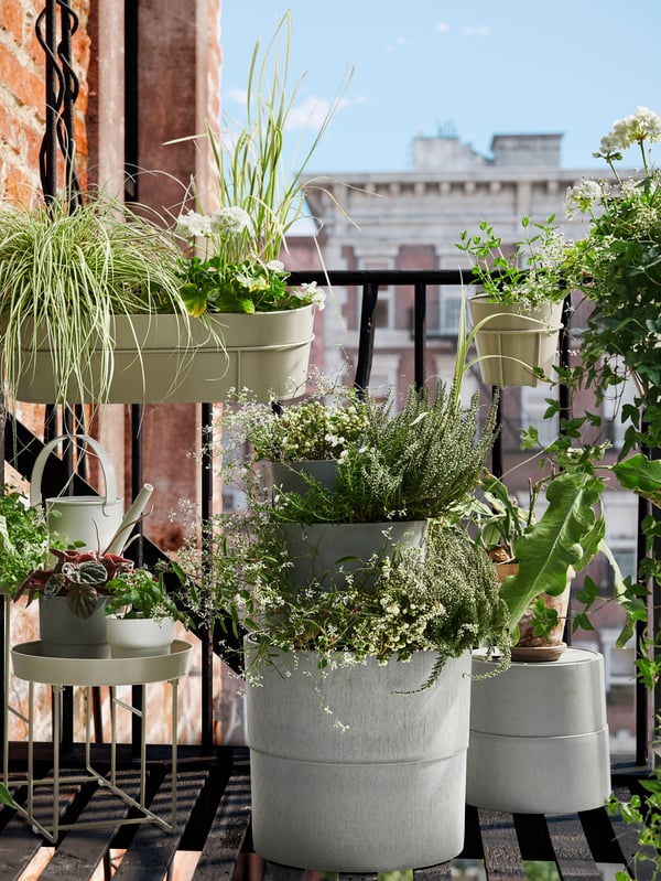 An in/outdoor grey NYPON plant pot outside