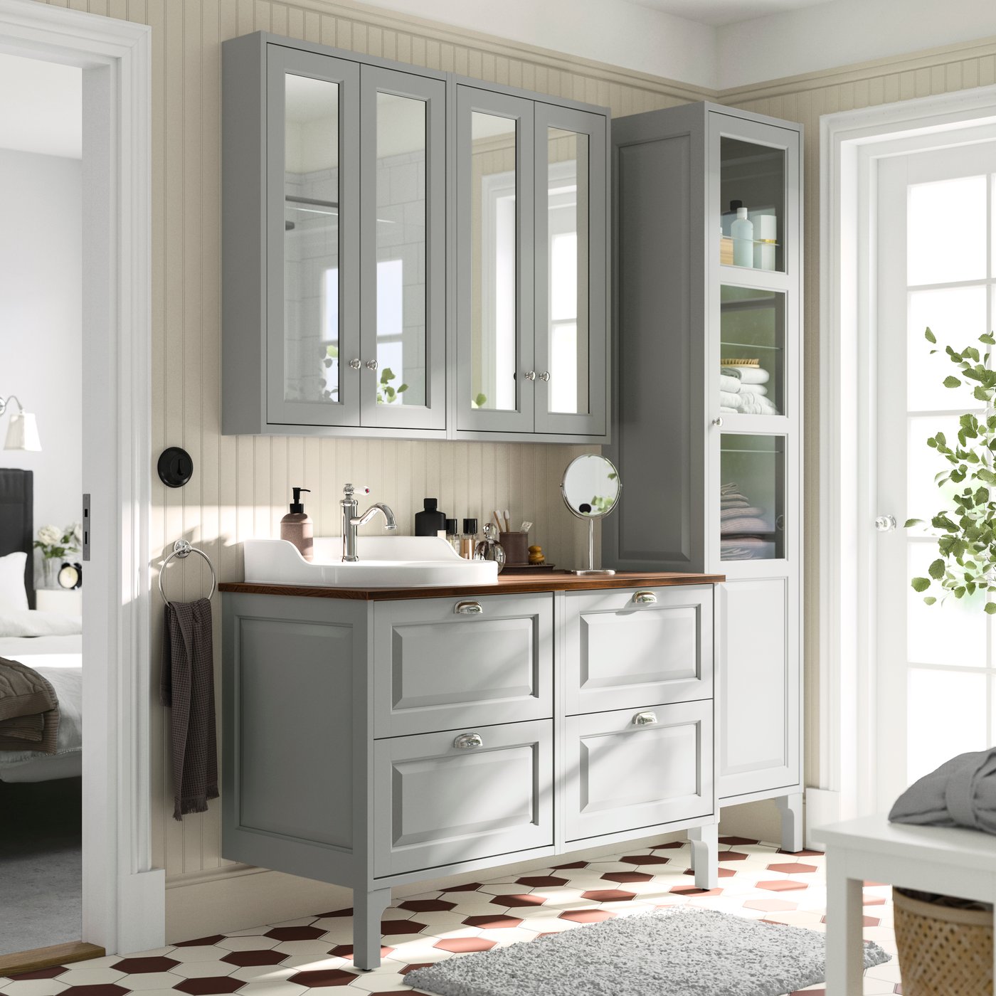A light grey/brown walnut effect RUTSJÖN wash-stand/wash-basin/tap in the bathroom