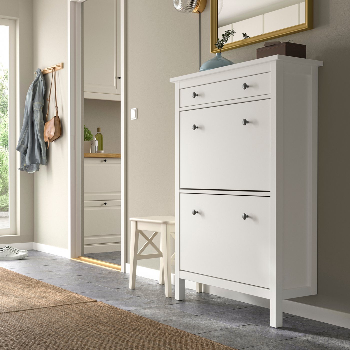 A white HEMNES shoe cabinet with 2 compartments