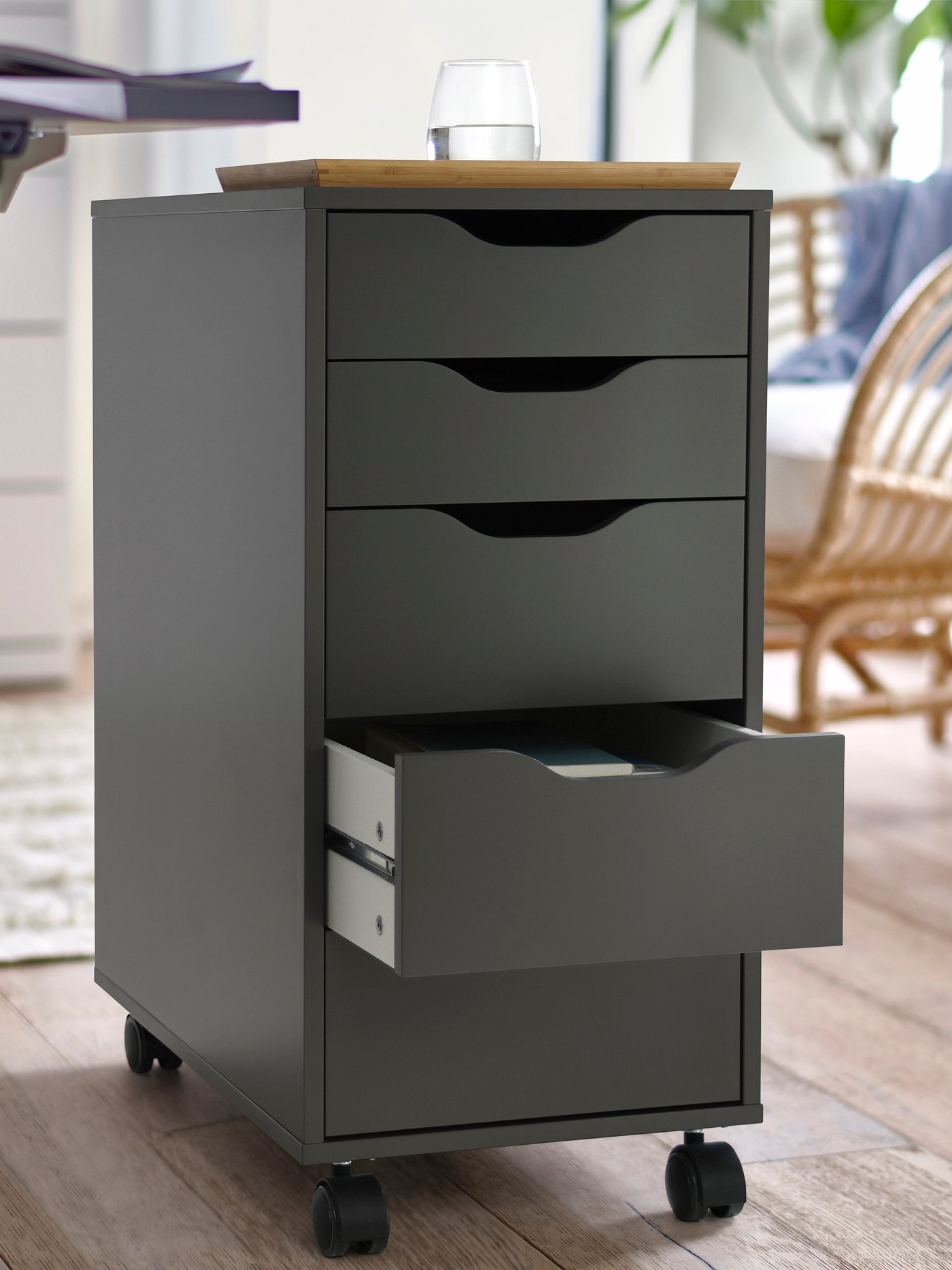 A dark grey/black ALEX drawer unit on castors