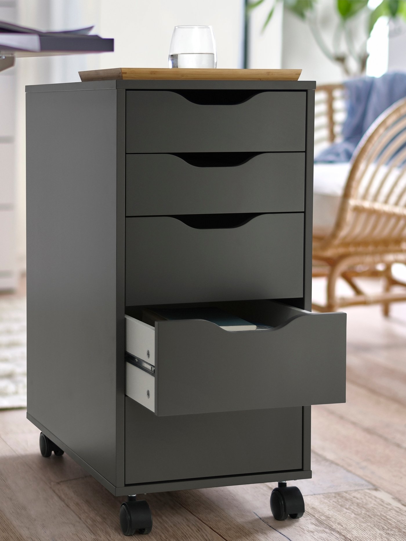A dark grey/black ALEX drawer unit on castors