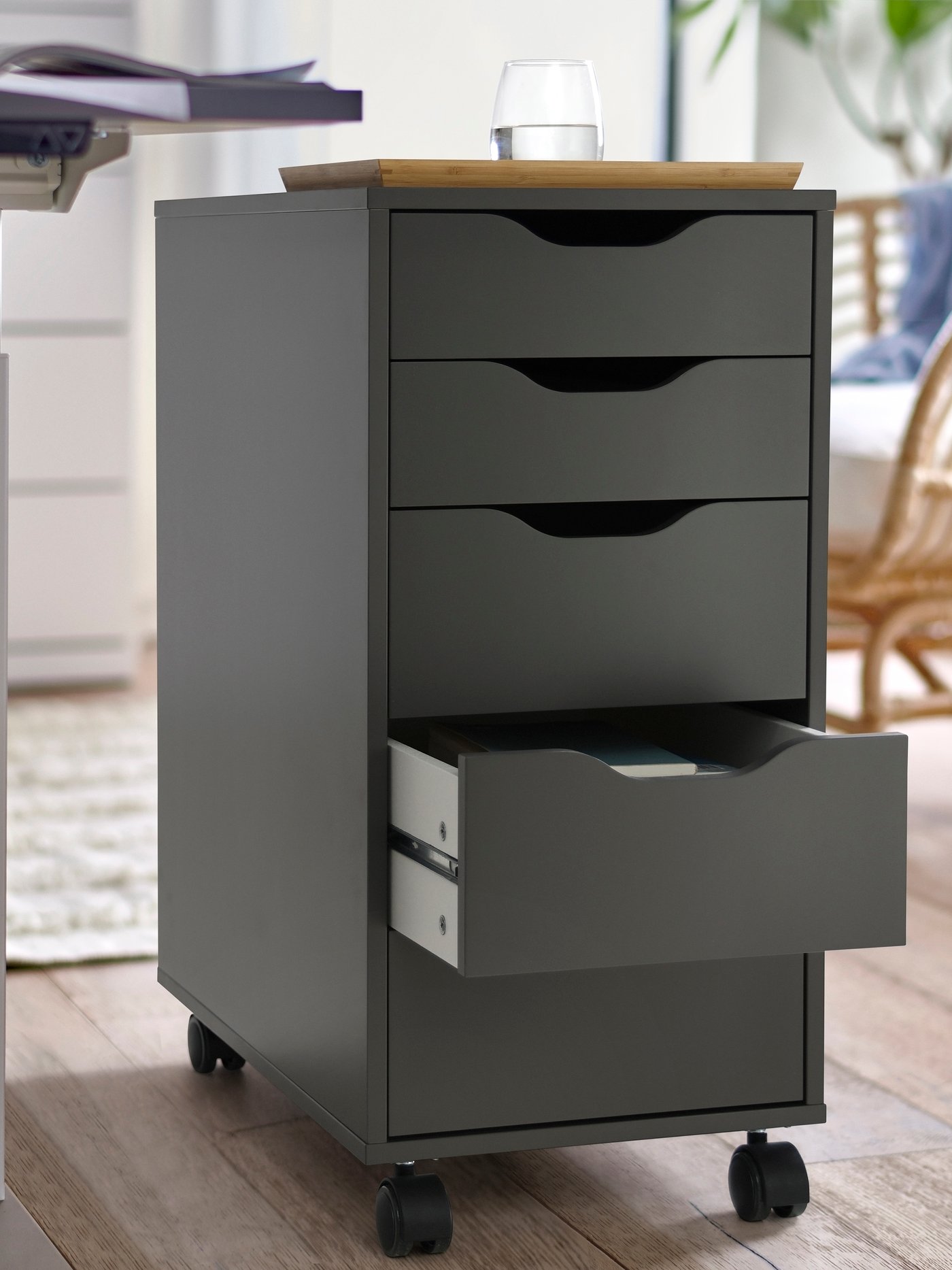 A dark grey/black ALEX drawer unit on castors