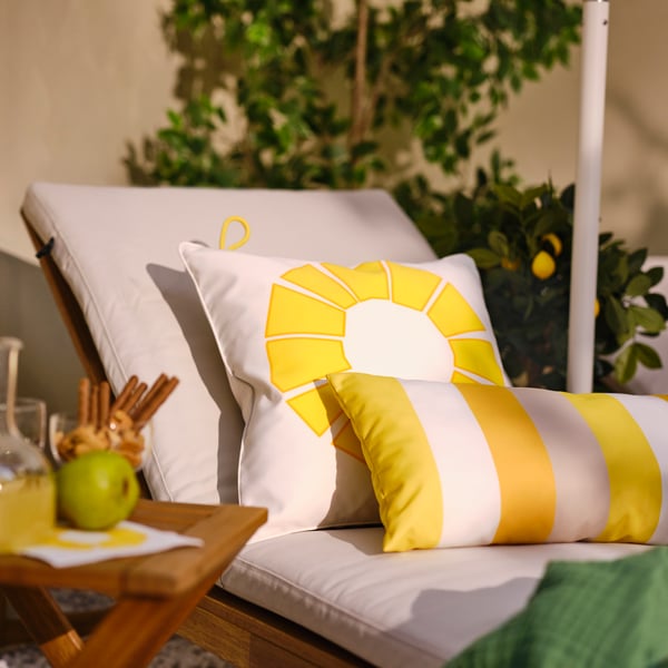 An yellow BRÖGGAN cushion, in/outdoor