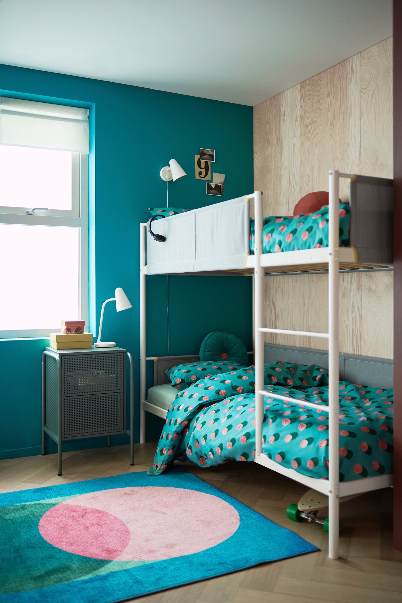 A white FUBBLA LED wall lamp in the childrens room