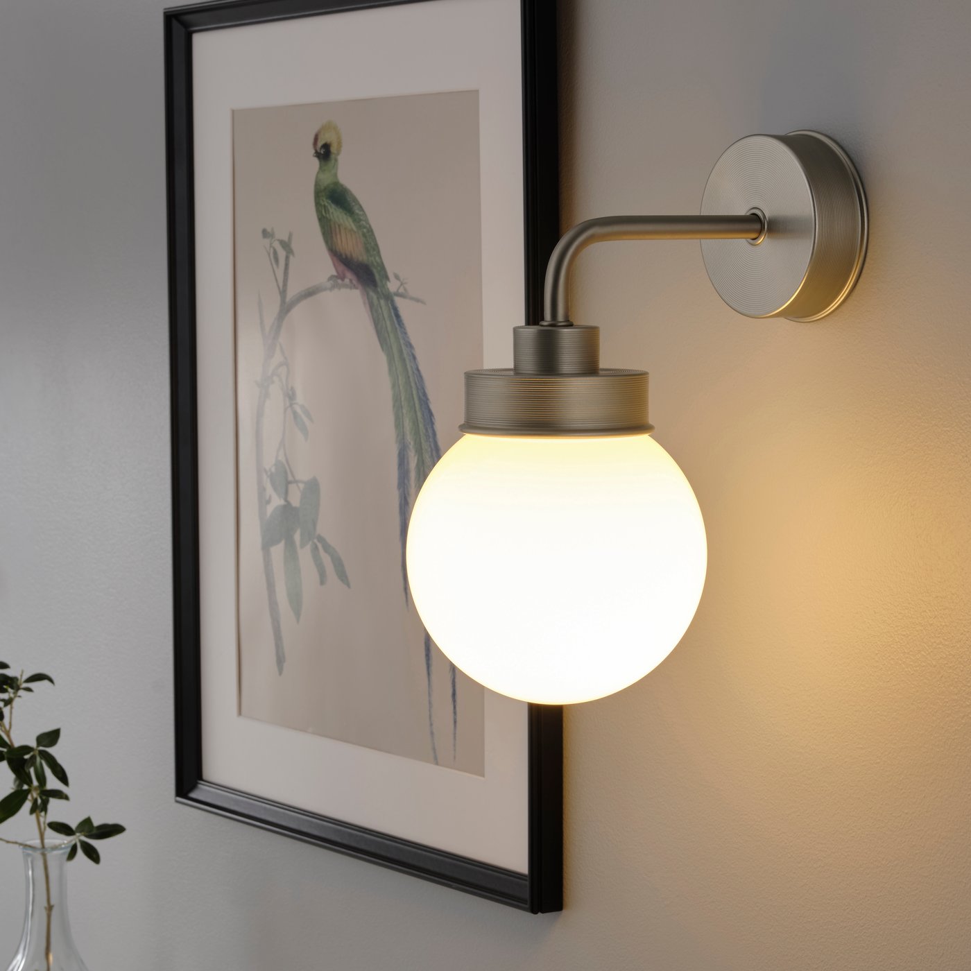 A stainless steel colour FRIHULT wall lamp