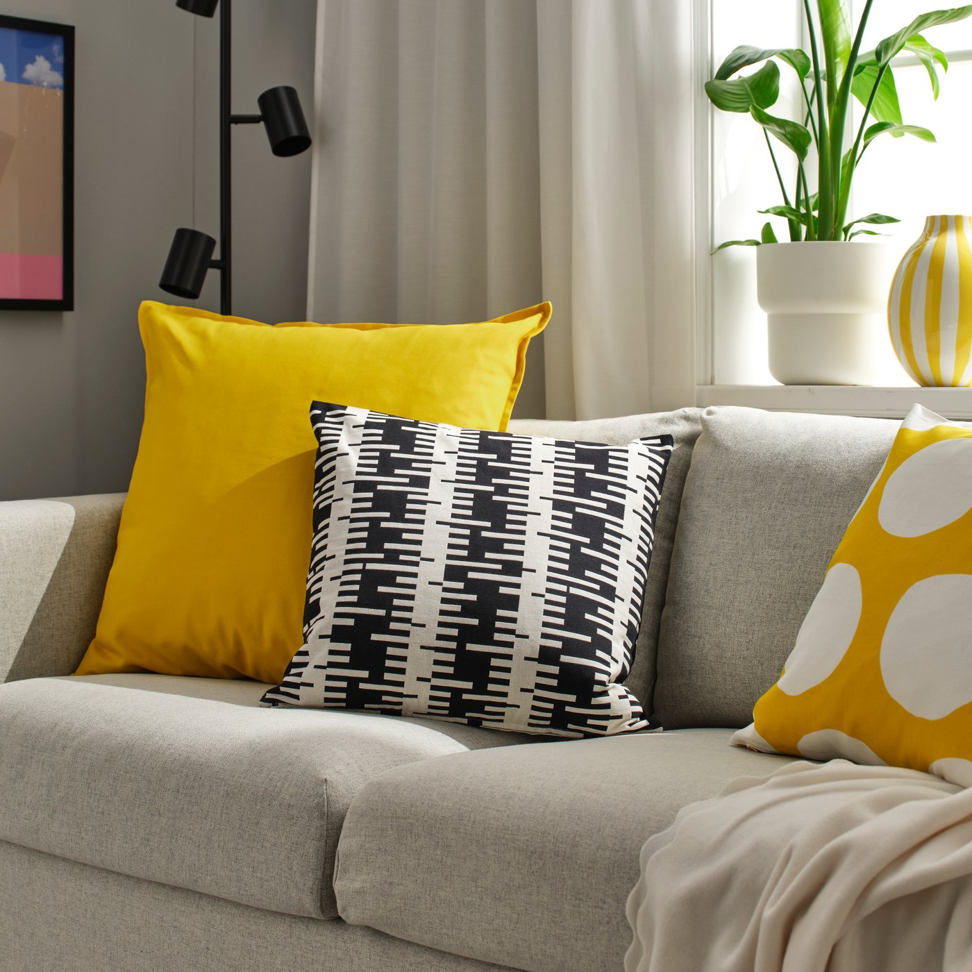 An yellow GURLI cushion cover in the living room