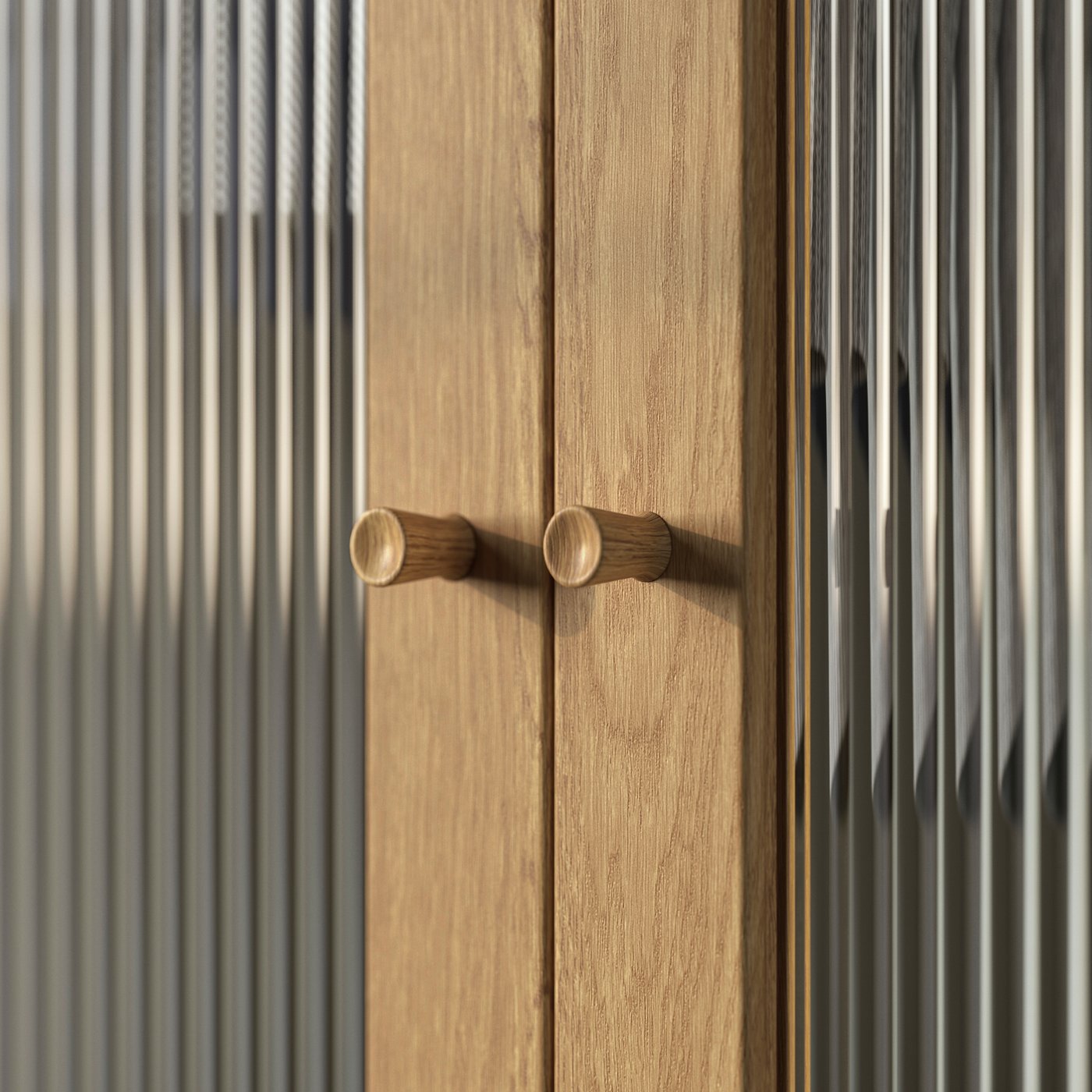 A close-up of oak veneer and glass TONSTAD doors, with TÄRNESTAD knobs made of oak.
