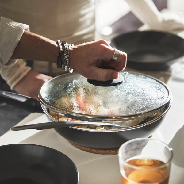 A non-stick coating black HEMLAGAD sauté pan with lid