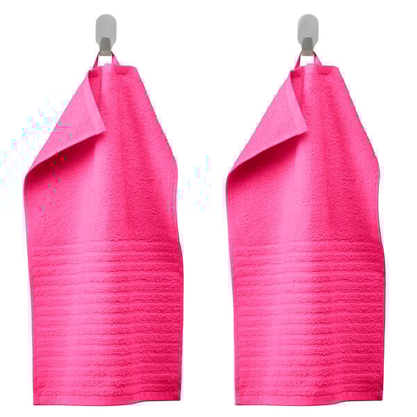 A bright pink VÅGSJÖN guest towel