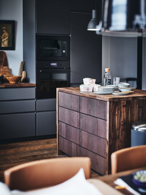Kitchen with 2 brown base cabinets with 4 fronts, 2 low and 3 middle drawers with built-in dampers supporting multiple bowls.