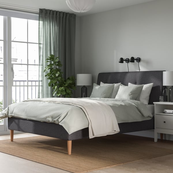 A Gunnared dark grey IDANÄS upholstered bed frame