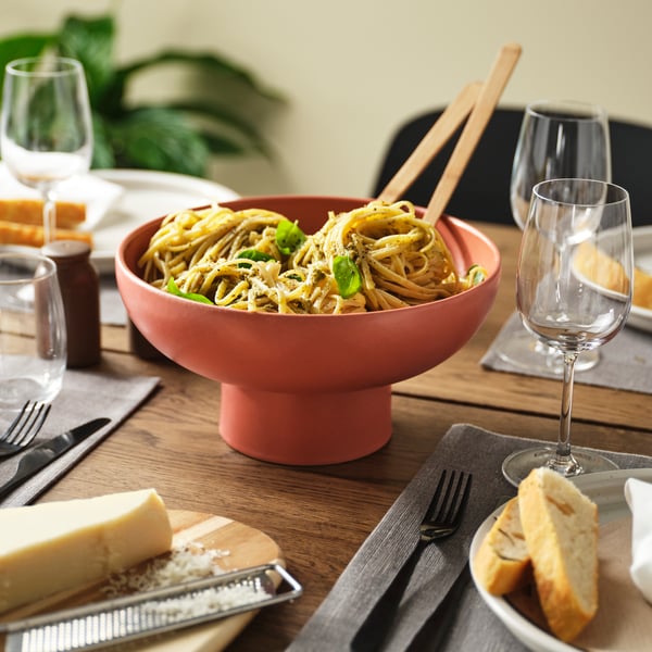 A red-brown BLOMVECKLARE serving bowl