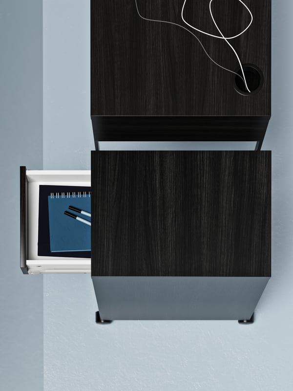 A black-brown MICKE drawer unit on castors