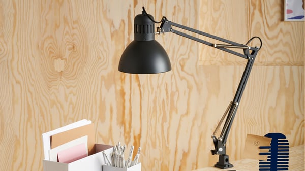 A dark grey TERTIAL work lamp in the home office