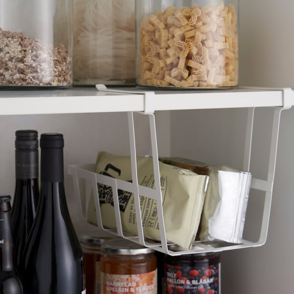 A PÅLYCKE clip-on basket in the kitchen