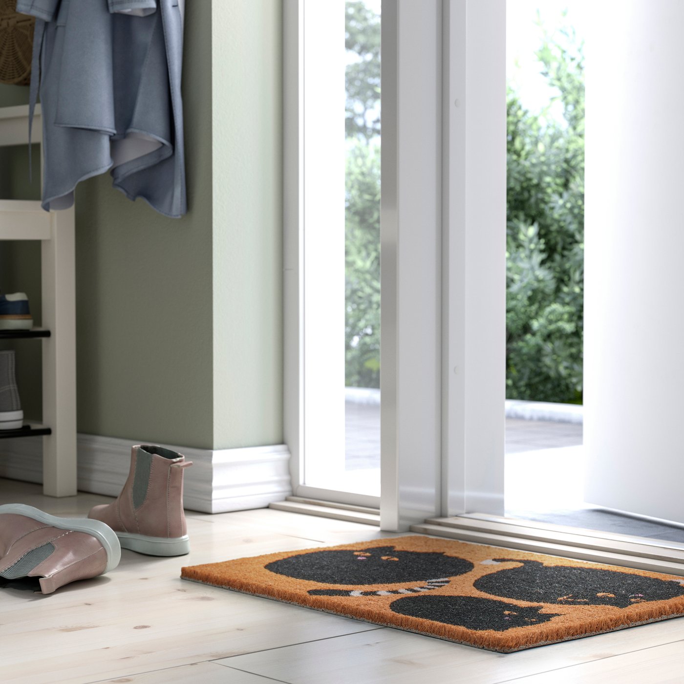 A cat black/natural VÄGTYP door mat in the hallway