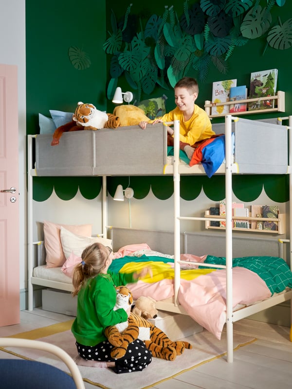 A light white stained pine FLISAT wall storage in the childrens room