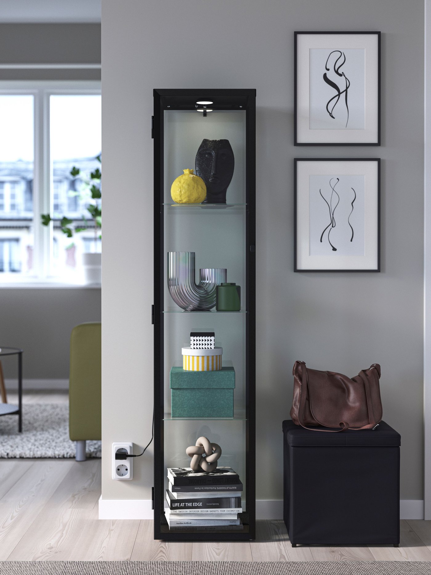 A black BLÅLIDEN glass-door cabinet