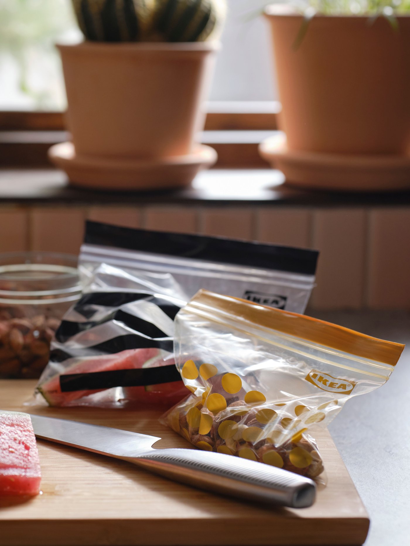 A patterned/black yellow ISTAD resealable bag in the kitchen