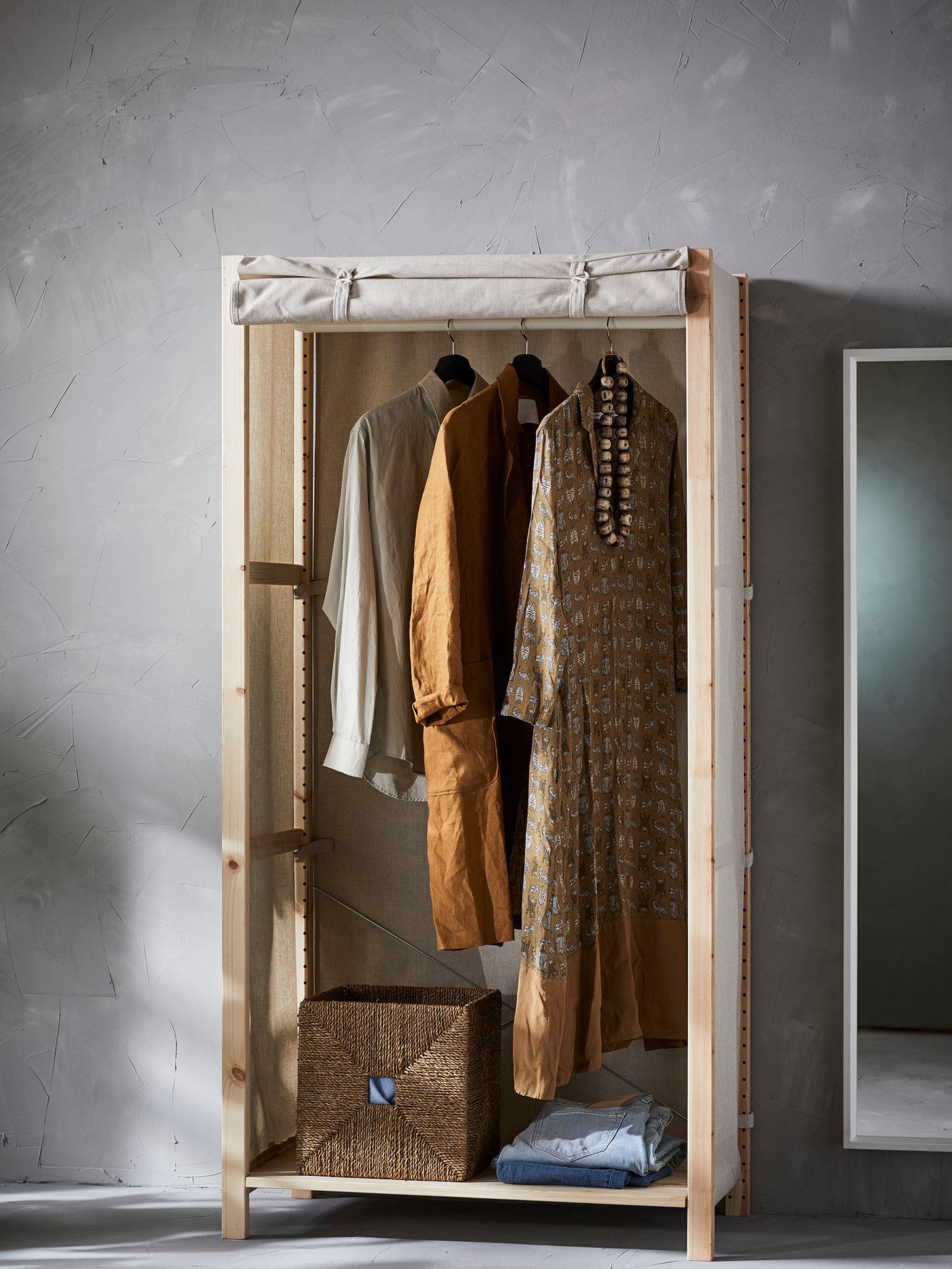 A white NISSEDAL mirror in the bedroom