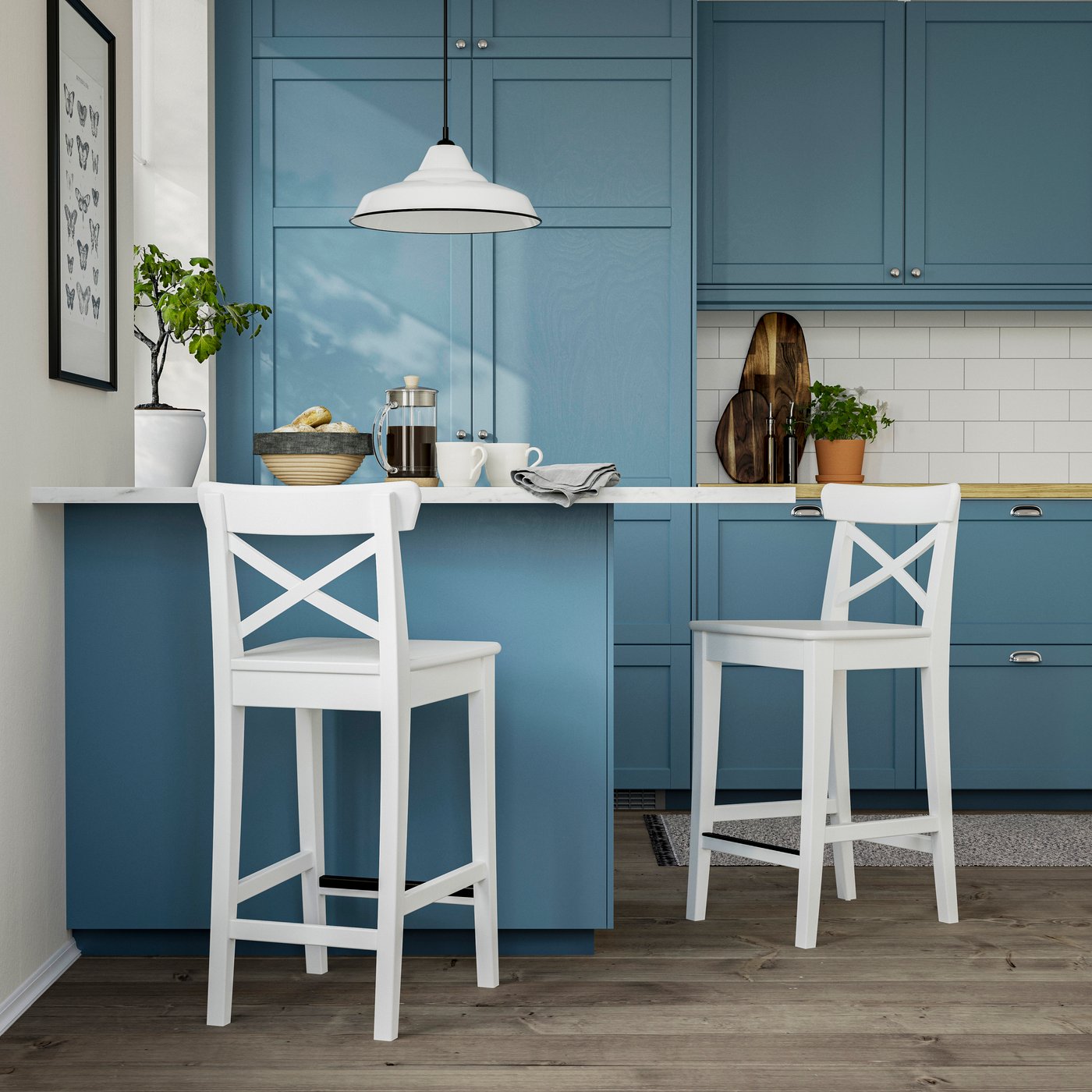 A counter height/white ROSENTORP bar stool with backrest