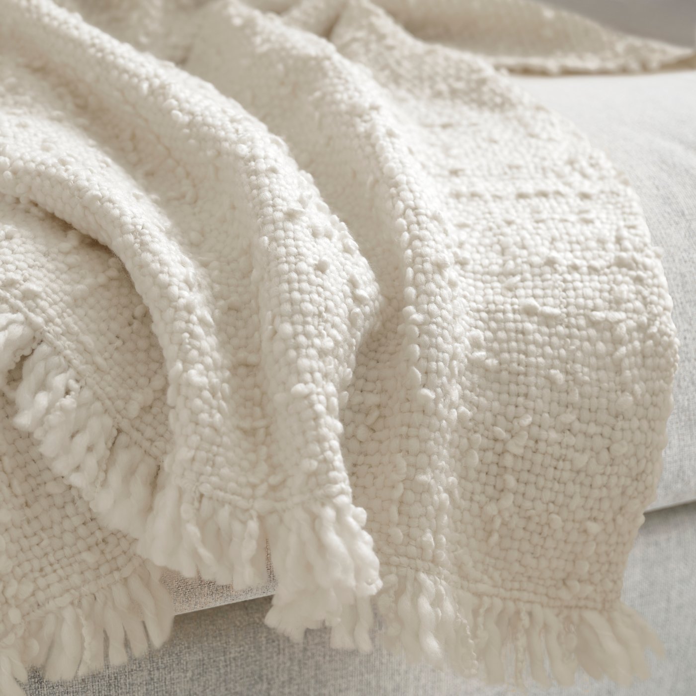 An off-white DYSTERMAL throw