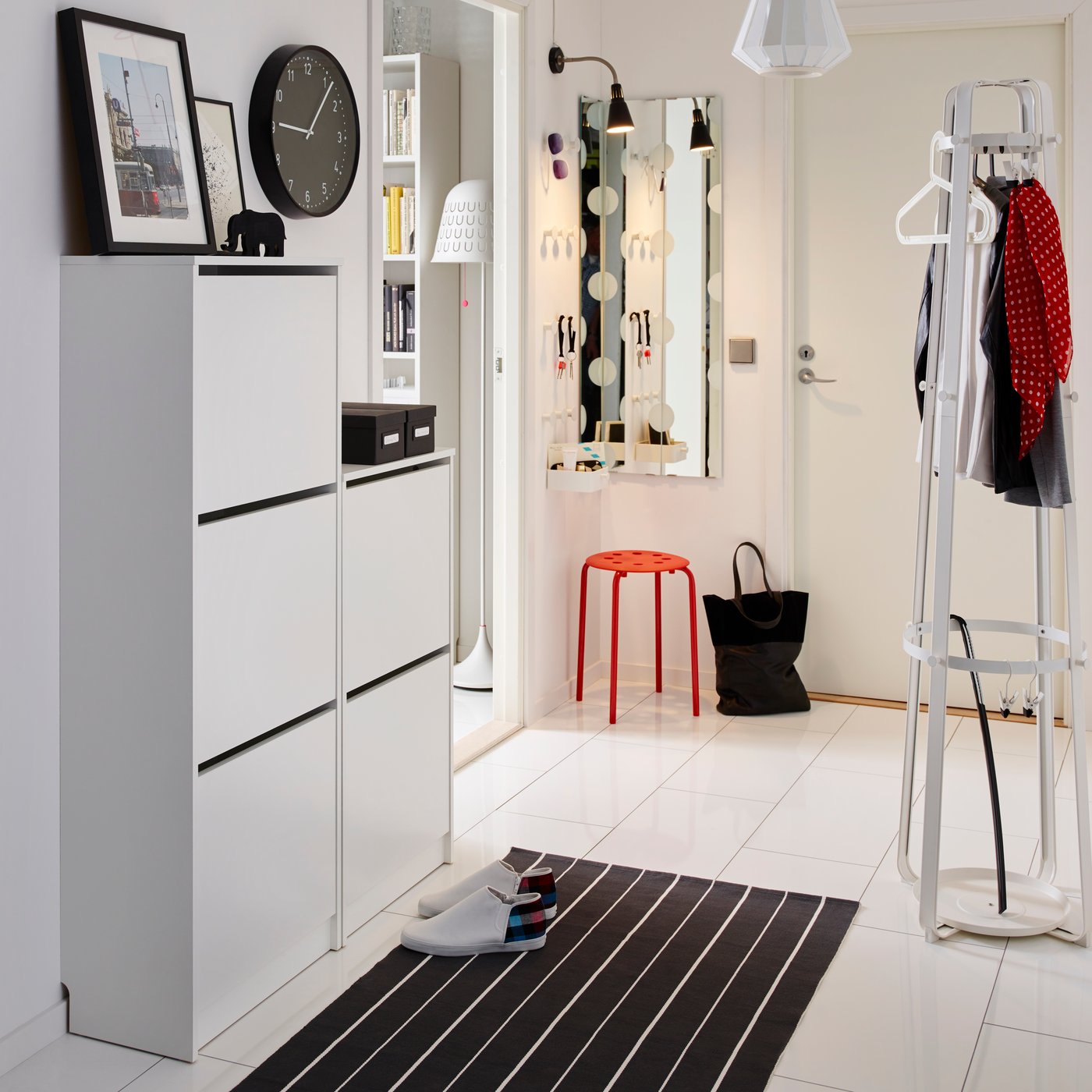 A white BISSA shoe cabinet with 2 compartments in the hallway
