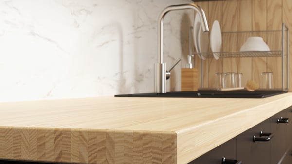 An ash/veneer PINNARP worktop in the kitchen