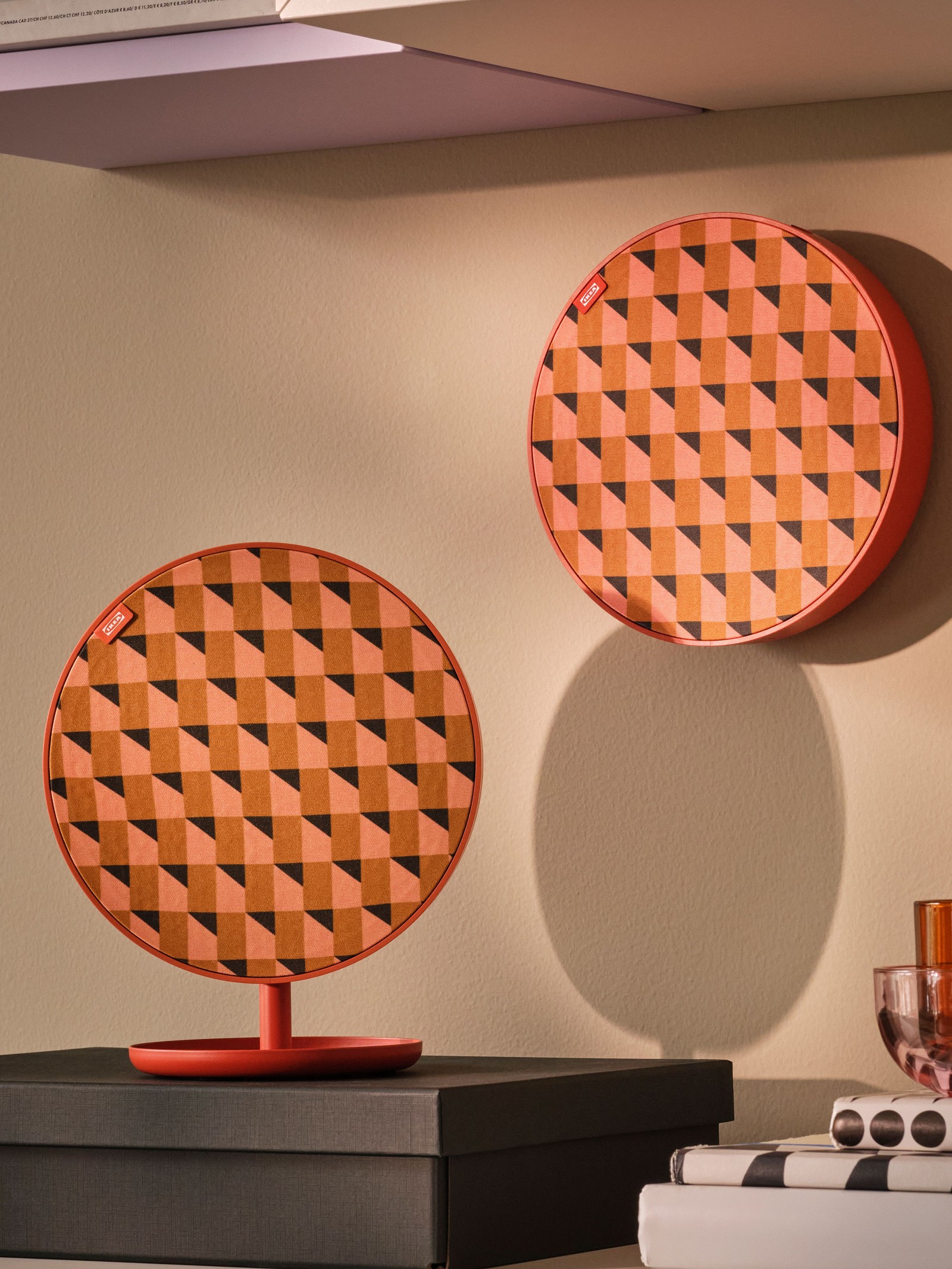 An orange SOLSKYDD portable Bluetooth speaker