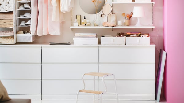 A white LAMPAN table lamp in the bedroom