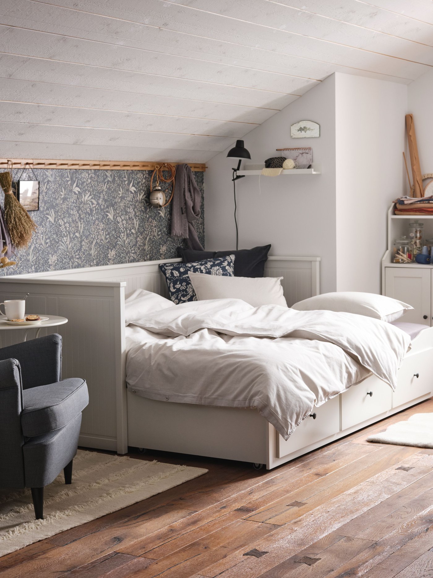 A black SKURUP floor/reading lamp in the bedroom