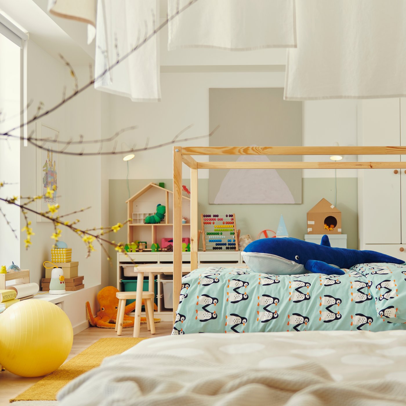 A blue whale BLÅVINGAD soft toy