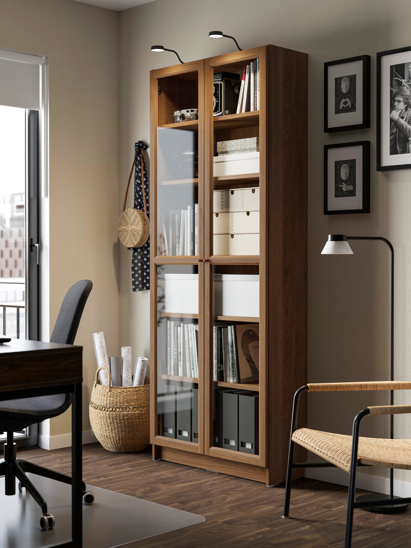 A brown walnut effect BILLY bookcase with glass doors in the home office